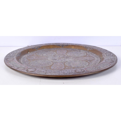 3771 - An Islamic copper and white metal dish 30 cm .