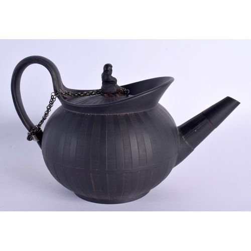 101 - A 19TH CENTURY WEDGWOOD BLACK BASALT TEAPOT ON STAND with figural finial. 20 cm wide. (2)