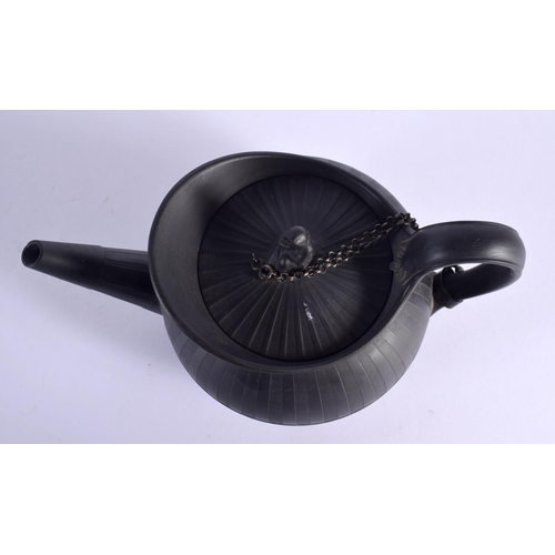 101 - A 19TH CENTURY WEDGWOOD BLACK BASALT TEAPOT ON STAND with figural finial. 20 cm wide. (2)