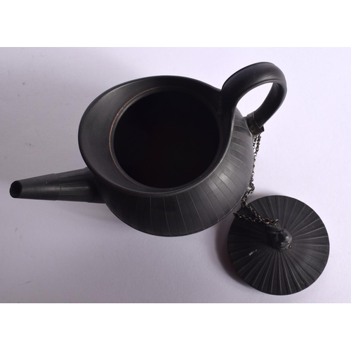 101 - A 19TH CENTURY WEDGWOOD BLACK BASALT TEAPOT ON STAND with figural finial. 20 cm wide. (2)