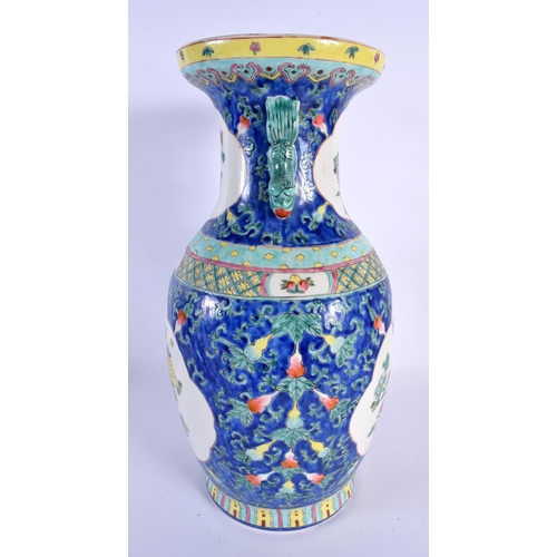 105 - A LARGE CHINESE REPUBLICAN PERIOD TWIN HANDLED PORCELAIN VASE decorated with foliage. 38 cm x 18 cm.