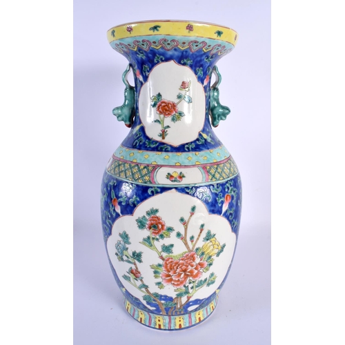 105 - A LARGE CHINESE REPUBLICAN PERIOD TWIN HANDLED PORCELAIN VASE decorated with foliage. 38 cm x 18 cm.