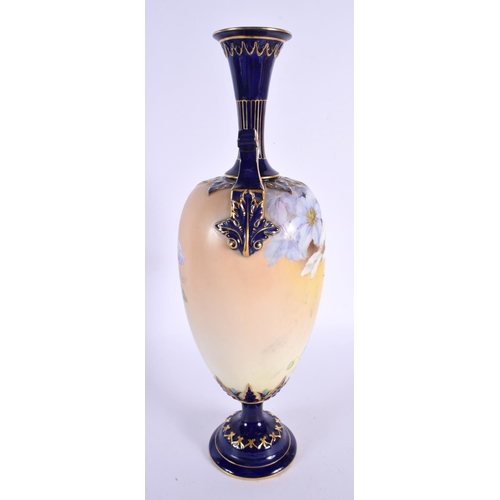 106 - A LARGE ROYAL WORCESTER TWIN HANDLED PORCELAIN VASE. 33 cm high.