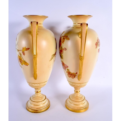 107 - A LARGE PAIR OF ROYAL WORCESTER TWIN HANDLED BLUSH IVORY VASES. 38 cm x 20 cm.