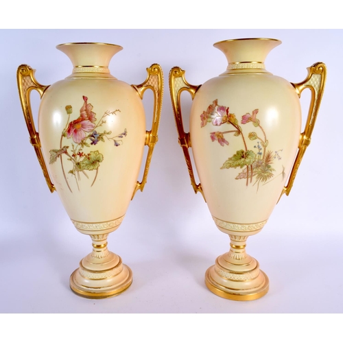 107 - A LARGE PAIR OF ROYAL WORCESTER TWIN HANDLED BLUSH IVORY VASES. 38 cm x 20 cm.