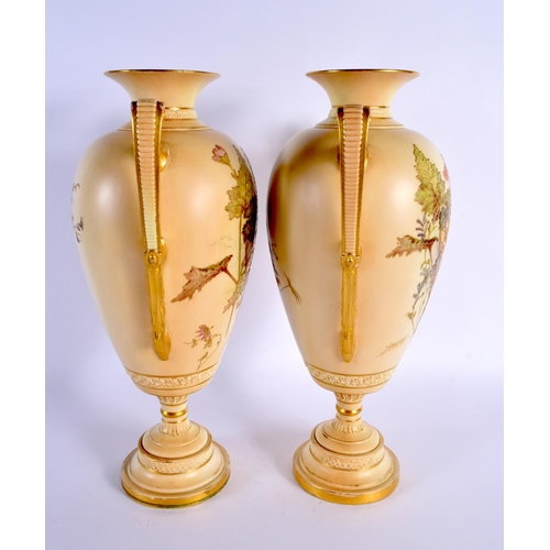 107 - A LARGE PAIR OF ROYAL WORCESTER TWIN HANDLED BLUSH IVORY VASES. 38 cm x 20 cm.