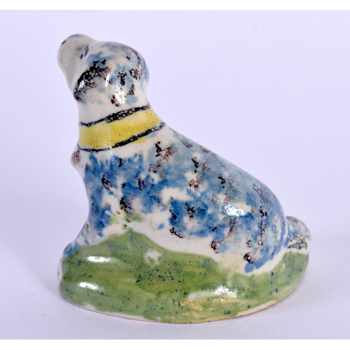 11 - AN 18TH CENTURY EUROPEAN DELFT FAIENCE PORCELAIN FIGURE OF A HOUND modelled recumbent. 5.5 cm x 6 cm... 