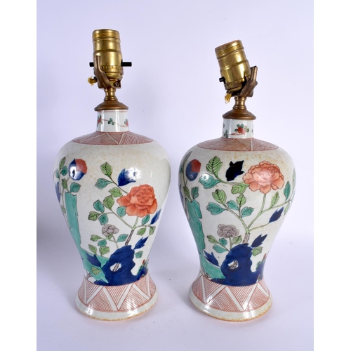 119 - A PAIR OF 19TH CENTURY FRENCH SAMSONS OF PARIS PORCELAIN LAMPS painted in the Kangxi style. 34 cm hi... 