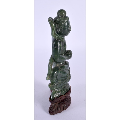 128 - A CHINESE QING DYNASTY CARVED SPINACH JADE IMMORTAL modelled clutching a censer. 15 cm x 7 cm.