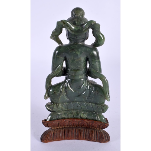 128 - A CHINESE QING DYNASTY CARVED SPINACH JADE IMMORTAL modelled clutching a censer. 15 cm x 7 cm.