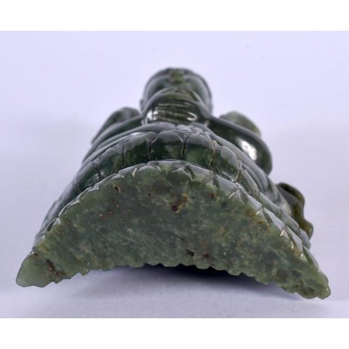 128 - A CHINESE QING DYNASTY CARVED SPINACH JADE IMMORTAL modelled clutching a censer. 15 cm x 7 cm.