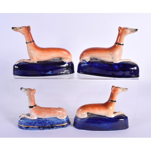 14 - TWO PAIRS OF 19TH CENTURY STAFFORDSHIRE GREYHOUNDS. Largest 15 cm x 12 cm. (4)