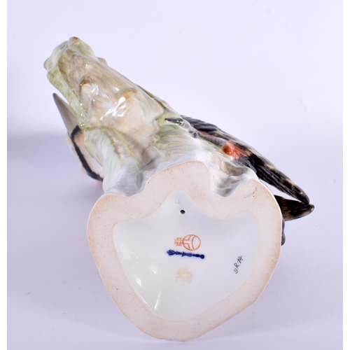 18 - AN UNUSUAL LARGE KPM BERLIN PORCELAIN FIGURE OF A BIRD modelled upon a stump. 25 cm x 16 cm.