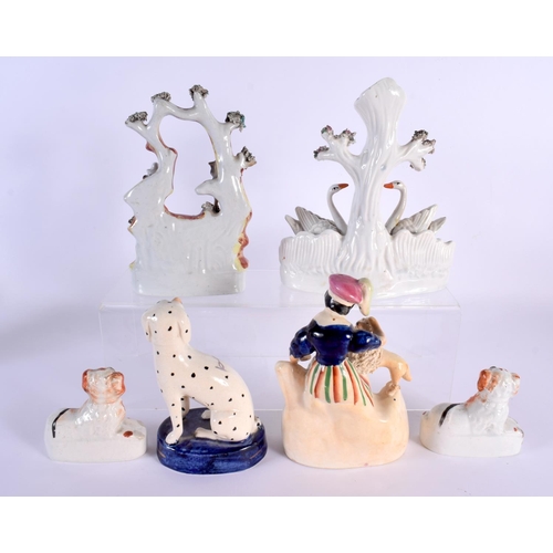 21 - SIX ANTIQUE STAFFORDSHIRE FIGURES including a swan group. Largest 21 cm x 10 cm. (6)