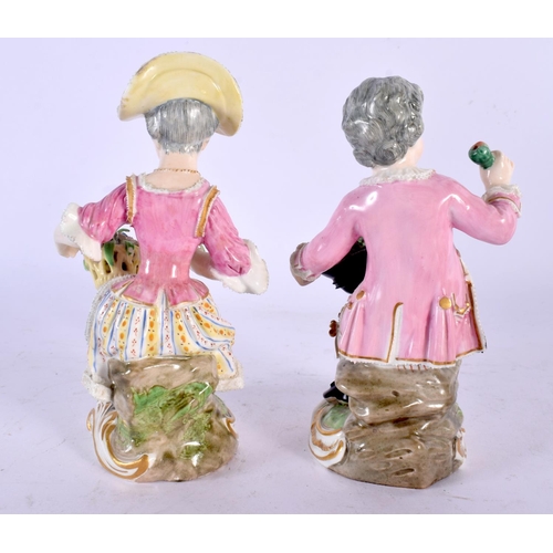 232 - DERBY PORCELAIN SEATED PAIR OF FIGURES, MODELLED AS A MAN WITH A HAT FILLED WITH FRUIT AND A WOMAN W... 