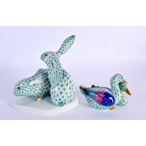 25 - A HEREND PORCELAIN FIGURE OF TWO RABBITS together with a smaller duck group. Largest 15 cm x 11 cm. ... 