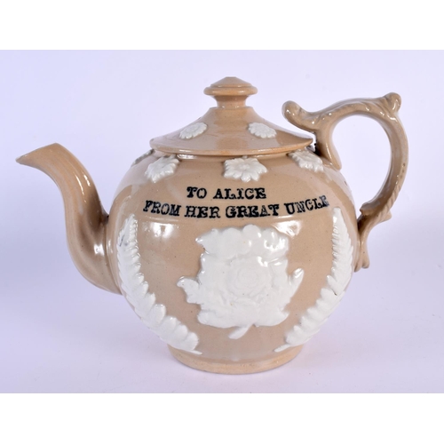 28 - AN UNUSUAL ANTIQUE DERBYSHIRE POTTERY TEAPOT AND COVER with family inscription. 21 cm x 18 cm.