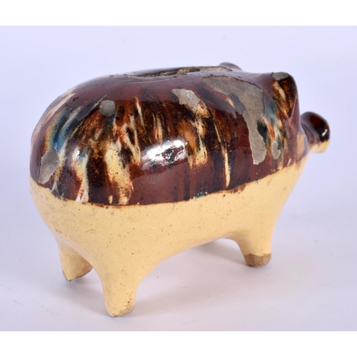 30 - A 19TH CENTURY ENGLISH TREACLE GLAZED POTTERY PIG MONEY BOX. 12 cm x 7 cm.