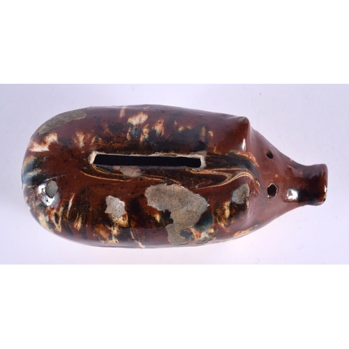 30 - A 19TH CENTURY ENGLISH TREACLE GLAZED POTTERY PIG MONEY BOX. 12 cm x 7 cm.