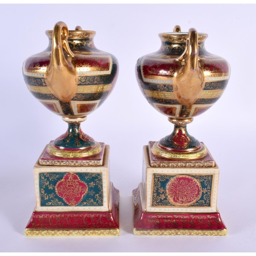 32 - A PAIR OF EARLY 20TH CENTURY VIENNA TWIN HANDLED PORCELAIN VASES decorated with figures. 18 cm x 12 ... 