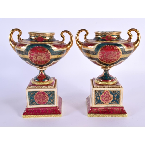 32 - A PAIR OF EARLY 20TH CENTURY VIENNA TWIN HANDLED PORCELAIN VASES decorated with figures. 18 cm x 12 ... 