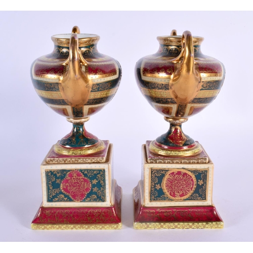 32 - A PAIR OF EARLY 20TH CENTURY VIENNA TWIN HANDLED PORCELAIN VASES decorated with figures. 18 cm x 12 ... 