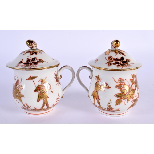 51 - AN UNUSUAL PAIR OF 19TH CENTURY CONTINENTAL PORCELAIN CUSTARD CUPS AND COVERS painted with unusual C... 