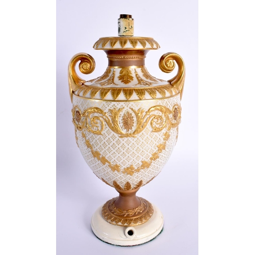 74 - A FINE 19TH CENTURY TWIN HANDLED EUROPEAN PORCELAIN EMPIRE VASE decorated in raised relief with swag... 