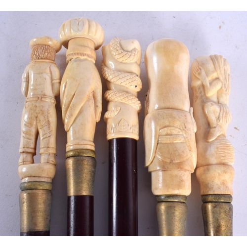 749 - FIVE CONTEMPORARY CARVED BONE WALKING CANES. 90 cm long. (5)