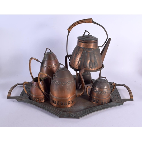 749A - A STYLISH SECESSIONIST MOVEMENT COPPER TEASET ON TRAY. Largest 52 cm x 32 cm. (6)