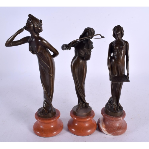 749B - A SET OF THREE CONTEMPORARY BRONZES. 22 cm high. (3)