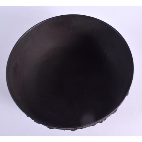 82 - A LARGE WEDGWOOD BLACK BASALT BOWL decorated with swags. 25 cm diameter.