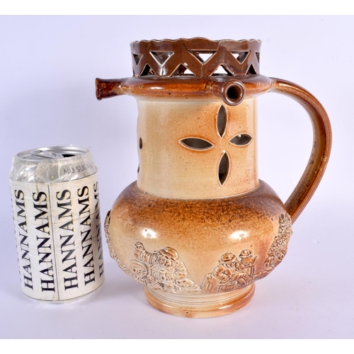 83 - AN UNUSUAL 19TH CENTURY ENGLISH STONEWARE PUZZLE JUG decorated with hunting scenes. 20 cm high.