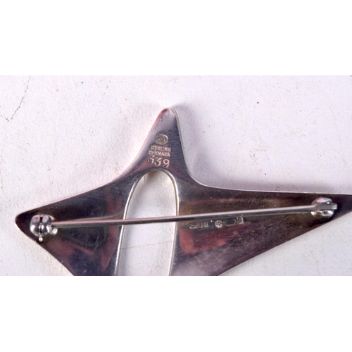 765E - GEORG JENSEN / HENNING KOPPEL SILVER STAR BROOCH.   Stamped Sterling Denmark, 5.9cm x 4.7cm, weight ... 