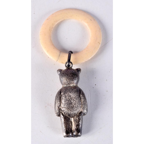 770A - AN ANTIQUE BONE TEETHING RING WITH A RATTLE IN THE FORM OF A BEAR.    11.4cm x 5.3cm, weight 15g