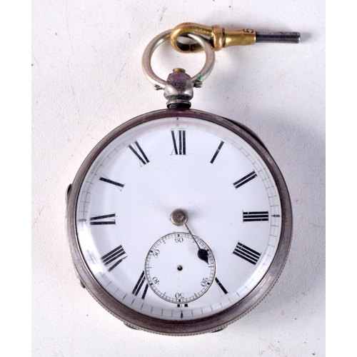 770B - A VICTORIAN SILVER POCKET WATCH WITH KEY.  Hallmarked Birmingham 1883, 5.2cm diameter, weight 127.7g