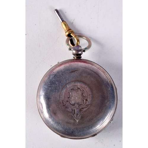 770B - A VICTORIAN SILVER POCKET WATCH WITH KEY.  Hallmarked Birmingham 1883, 5.2cm diameter, weight 127.7g