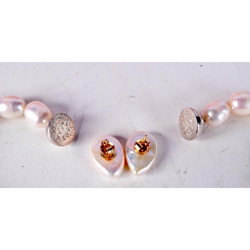 775E - A CULTURED PEARL NECKLACE TOGETHER WITH A PAIR OF 9CT GOLD BACKED PEARL EARRINGS.  Necklace 45cm lon... 