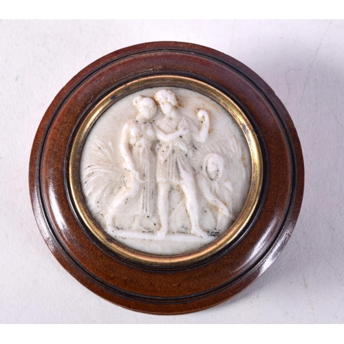 780B - A TURNED WOOD PILL BOX WITH A STONE CAMEO INSERT.  4.7cm x 2.4cm