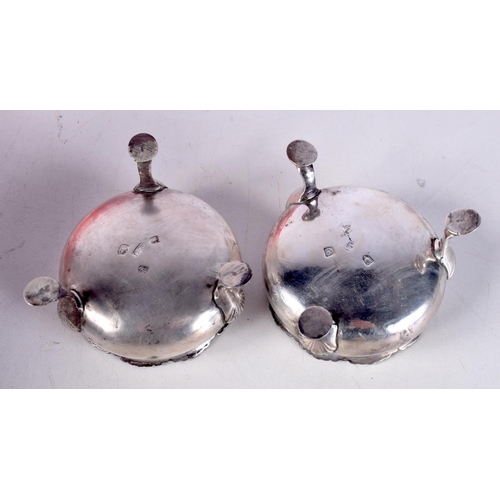 792 - A PAIR OF VICTORIAN SILVER SALTS WITH BLUE GLASS LINERS.  Hallmarked London 1840.  4cm x 6.2cm, weig... 