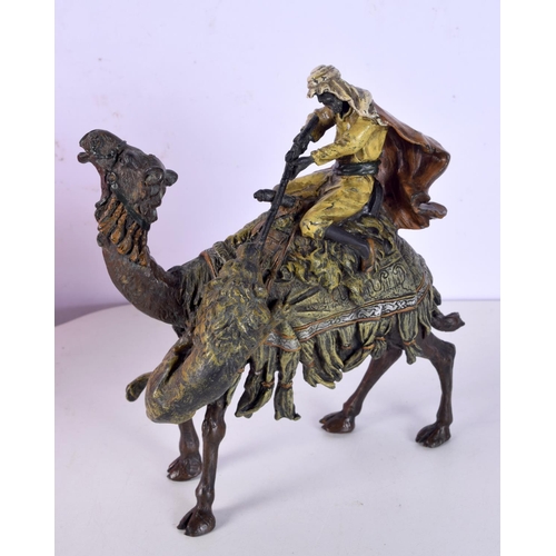 817 - A COLD PAINTED BRONZE IN THE BERGMAN STYLE OF A LION ATTACKING AN ARAB MOUNTED ON A CAMEL.  17cm x 1... 