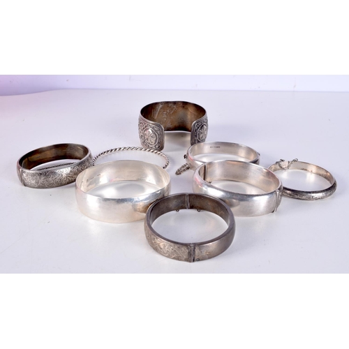 822 - EIGHT SILVER BANGLES.  Various Hallmarks, total weight 206g (8)