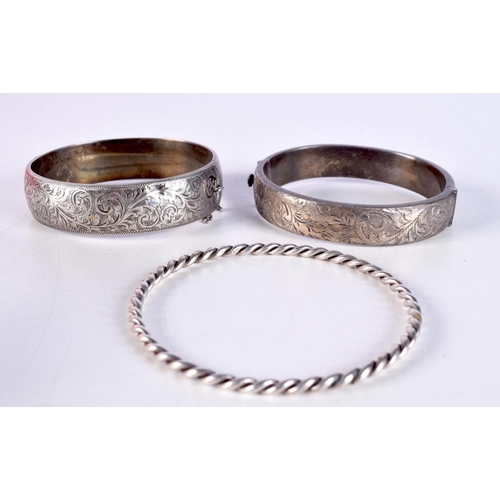 822 - EIGHT SILVER BANGLES.  Various Hallmarks, total weight 206g (8)