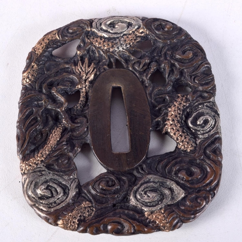 823 - A JAPANESE TSUBA DECORATED WITH A DRAGON.  8.3cm x 7.4cm, weight 147g