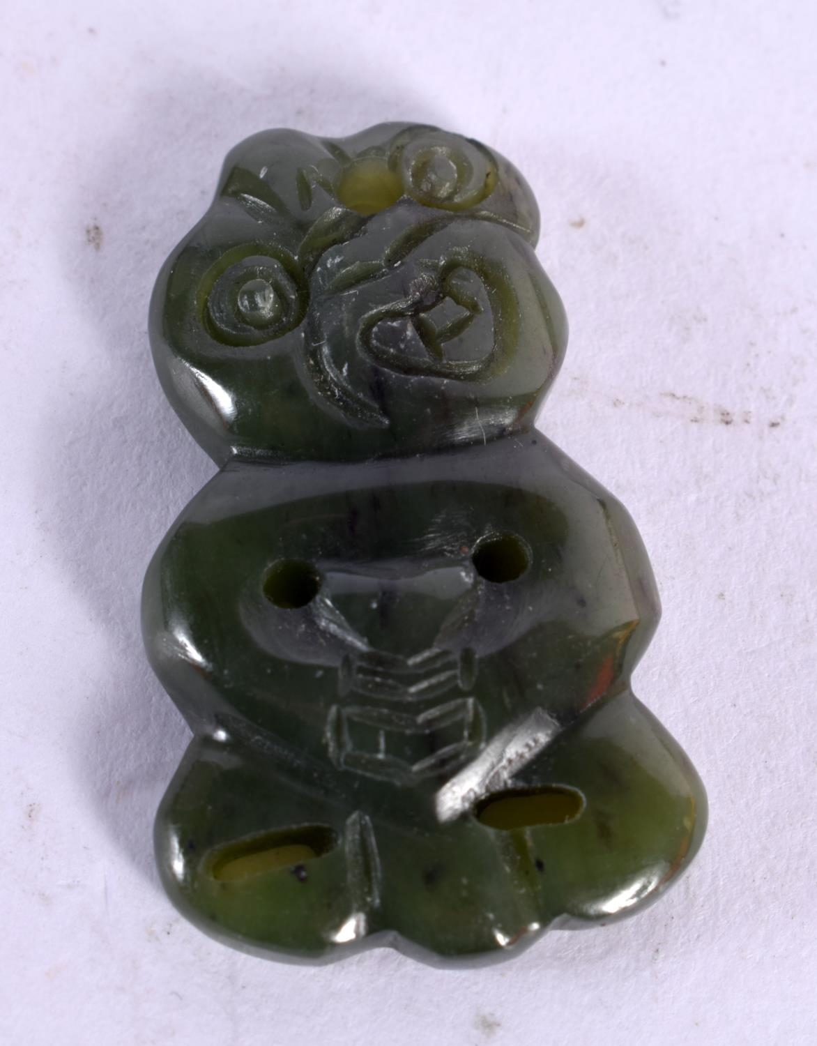 A NEW ZEALAND MAORI JADE TIKI PENDANT. 3 cm x 2 cm.