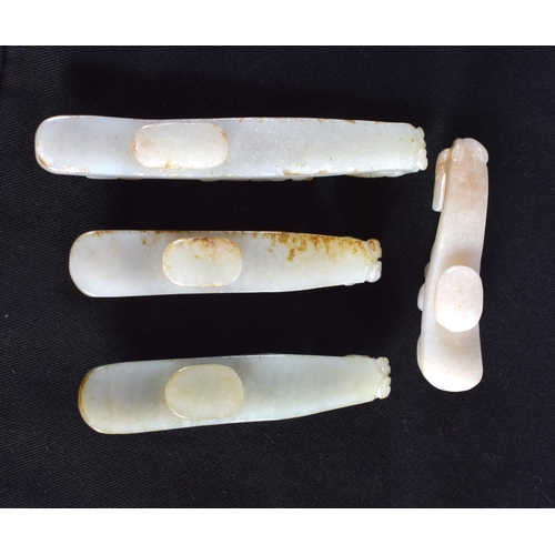 1501 - A GROUP OF SEVEN 19TH/20TH CENTURY CHINESE CARVED JADE BELT HOOKS in various forms and sizes. Larges... 