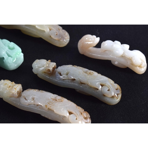 1501 - A GROUP OF SEVEN 19TH/20TH CENTURY CHINESE CARVED JADE BELT HOOKS in various forms and sizes. Larges... 