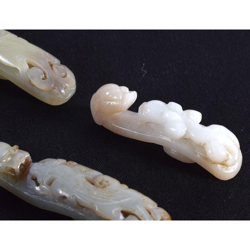 1501 - A GROUP OF SEVEN 19TH/20TH CENTURY CHINESE CARVED JADE BELT HOOKS in various forms and sizes. Larges... 