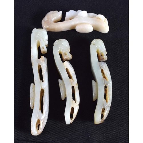 1501 - A GROUP OF SEVEN 19TH/20TH CENTURY CHINESE CARVED JADE BELT HOOKS in various forms and sizes. Larges... 