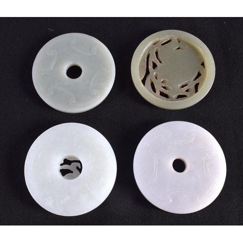 1503 - A GROUP OF NINE 19TH/20TH CENTURY CHINESE CARVED JADE BI DISCS in various forms and sizes. Largest 6... 